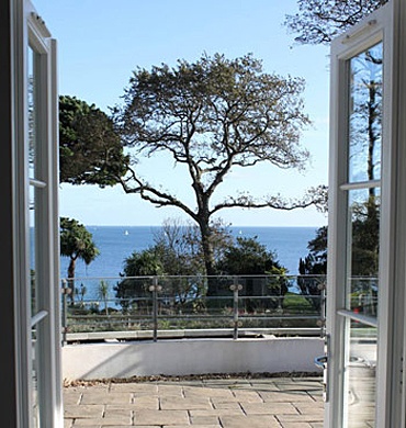 Doors leading to private terrace with stunning views across Falmouth Bay