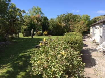 The tranquil landscaped grounds at Crown Inn Lodges