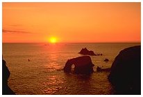 Cliffs and the Atlantic Ocean at Lands End at sunset. Walking the Coastal Footpath offers numerous spectacular sea views