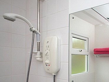 Bathroom with an electric shower over the bath