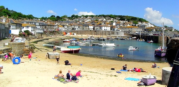 Mousehole has a small sandy beach and fishing harbour