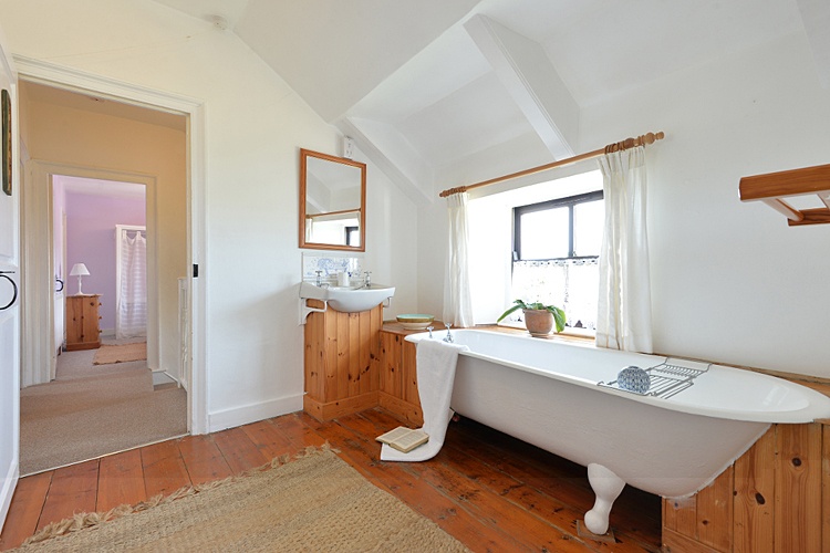 Bathroom with antique roll-top bath