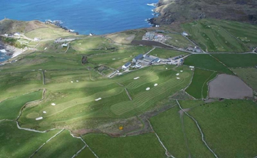 Aerial view of Cape Cornwall golf course by the sea