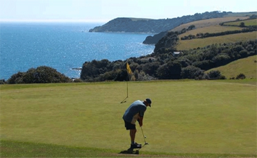 Putting on one of the greens at Porthpean golf course