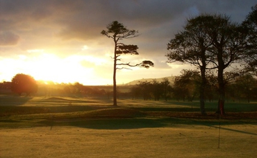 Sun setting over Tehidy Park golf course