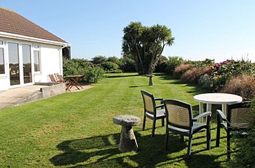Large lawn area with garden furniture