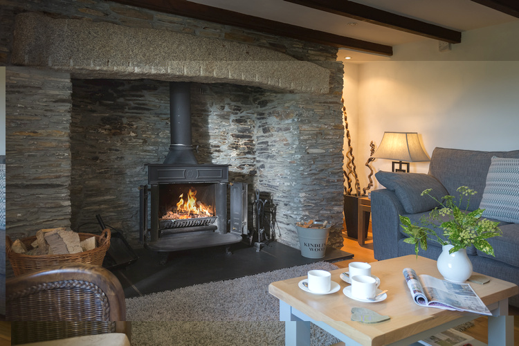The cosy sitting room with woodburner