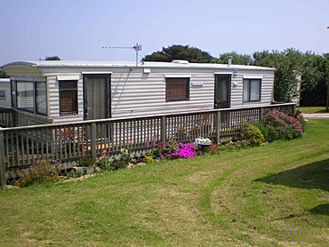 Static caravan with lovely flowers