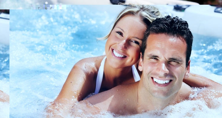 Couple relaxing in a hot tub at a River Valley lodge