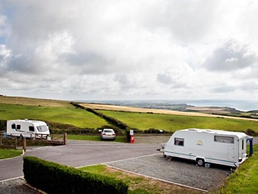 Spacious touring pitches at Sandymouth with hardstanding and views of the sea