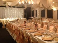 Large function room laid out for a wedding banquet