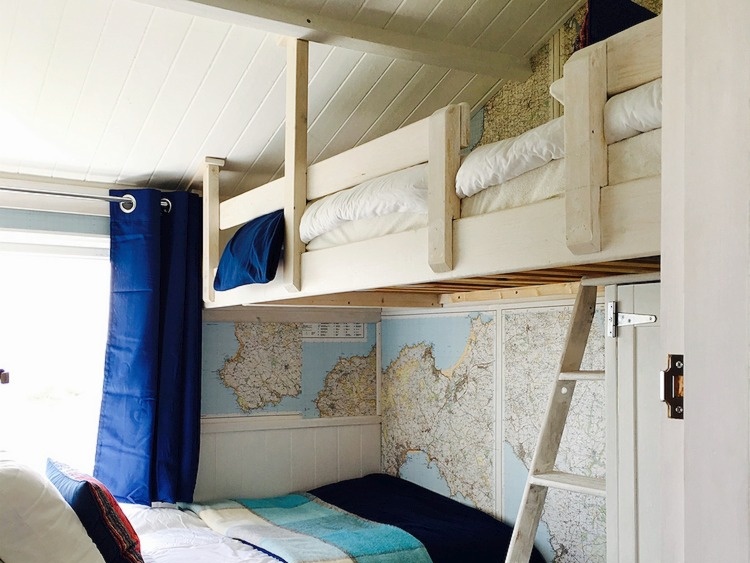 The bunk room has two short beds suitable for children or small adults