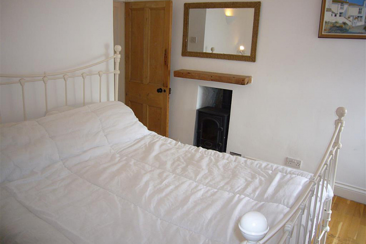 Bedroom 3 with large double bed and window seat